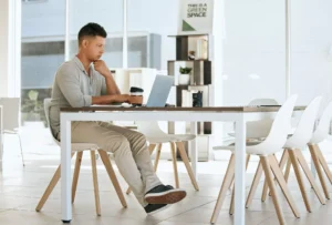 Businessman thinking or laptop typing in modern office for email marketing campaign advertising s