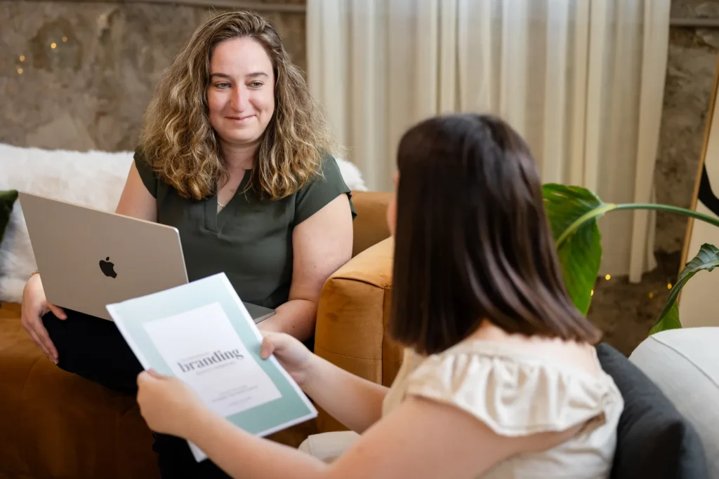 Kristen Jerry reviewing a brand presentation with a client