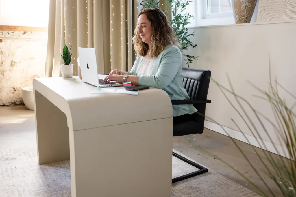 Kristen Jerry typing at her desk